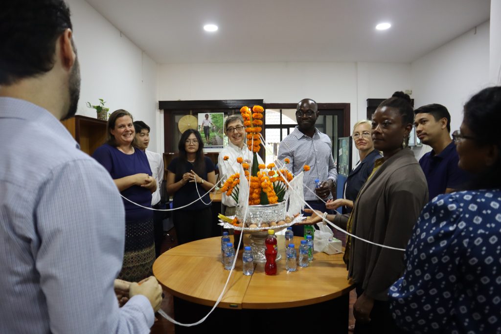 Following the embassy visit, the team transferred to the CRS office for a welcome reception. This included a traditional Lao Baci celebration organized in honor of the team’s visit. Photo by Thipphakesone Saylath.