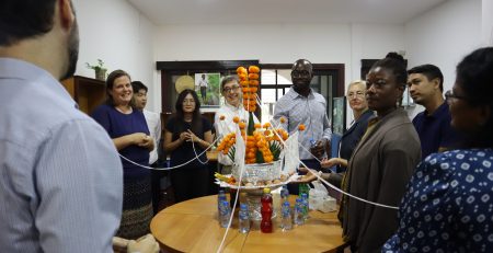 Following the embassy visit, the team transferred to the CRS office for a welcome reception. This included a traditional Lao Baci celebration organized in honor of the team’s visit. Photo by Thipphakesone Saylath