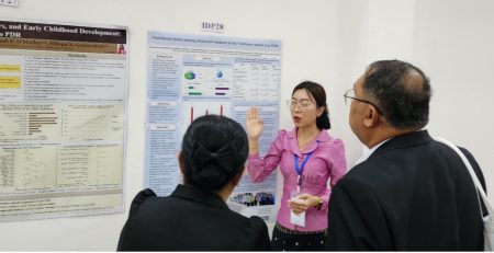 Hongkham Xayavong (Lao TPHI) presenting her team’s poster on the nutritional status of adolescent students in Lao PDR